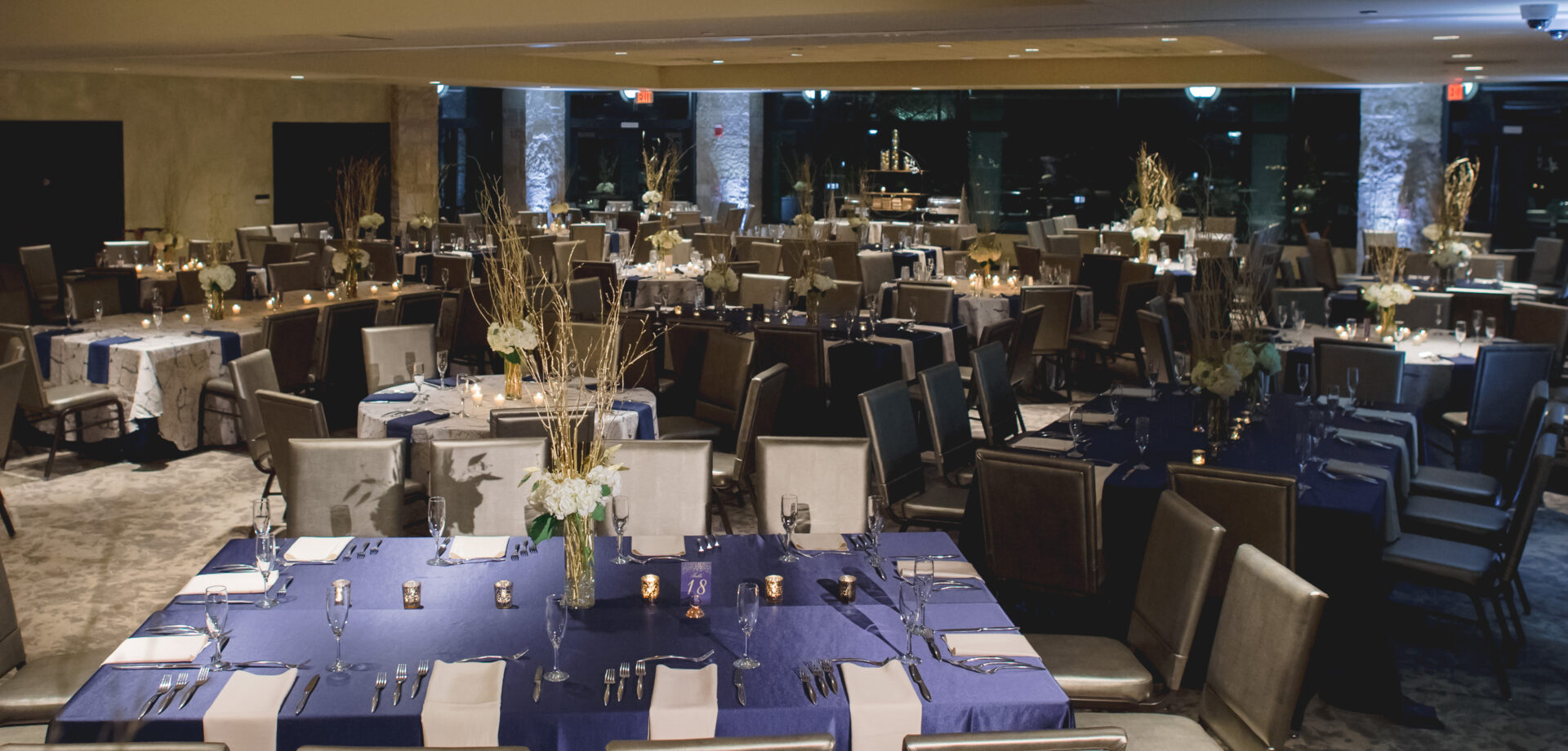 Set tables in blue theme at Miller Room